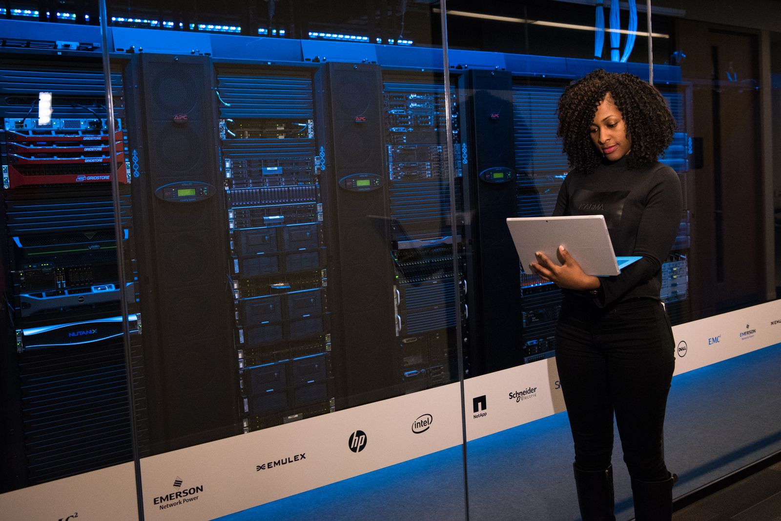 Engineer inspecting infrastructure with a laptop